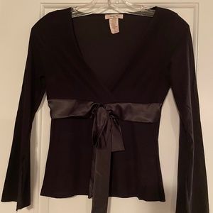 Sexy black blouse with satin bow detail and bell sleeves